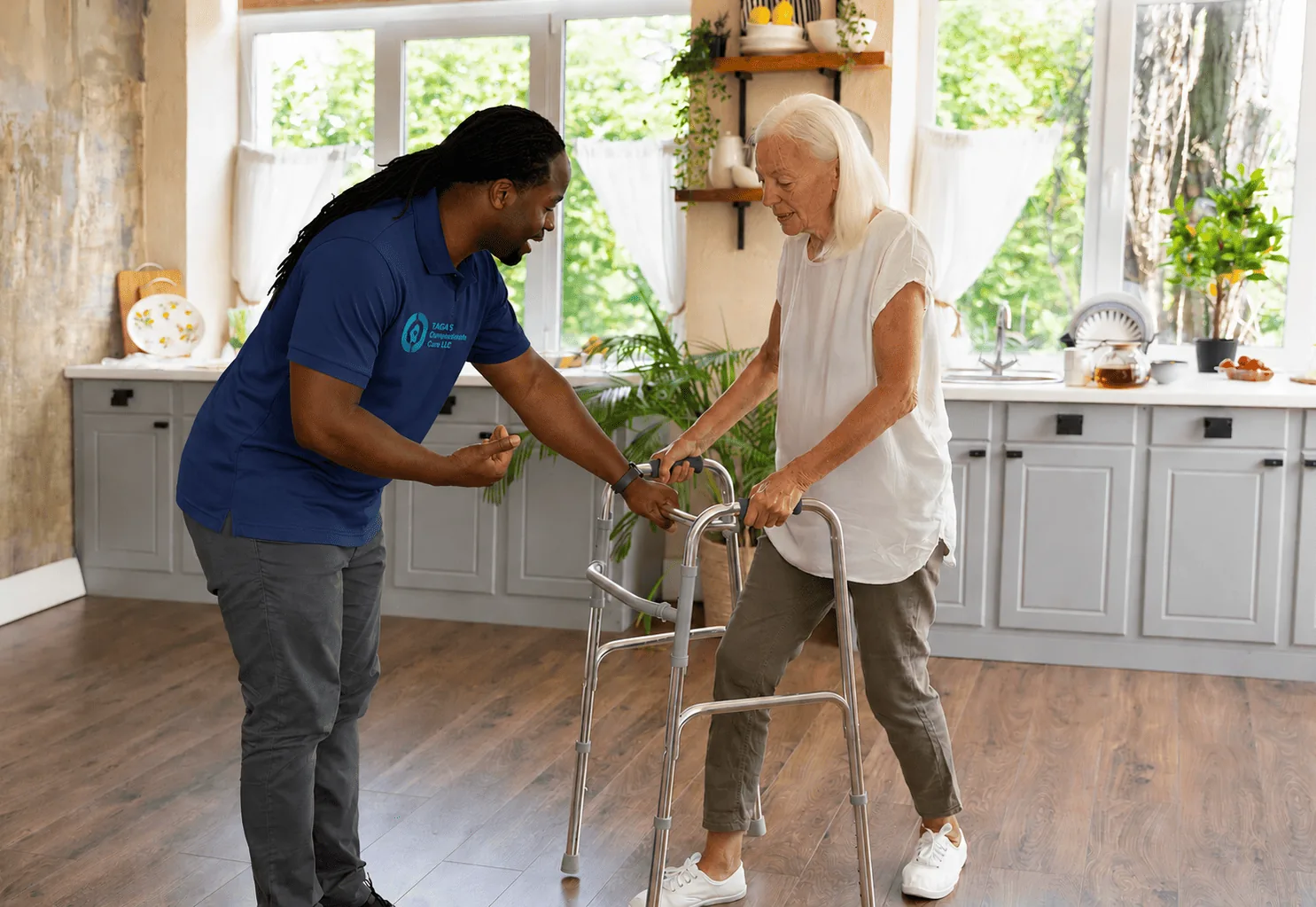 Support worker helping an older adult steady herself on a walker at home